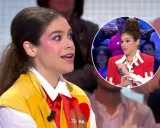 Cosima Ruiz de la Prada, con maquillaje llamativo y un chaleco amarillo, habla en un programa. En un círculo, se ve su peinado alto y chaqueta roja.
